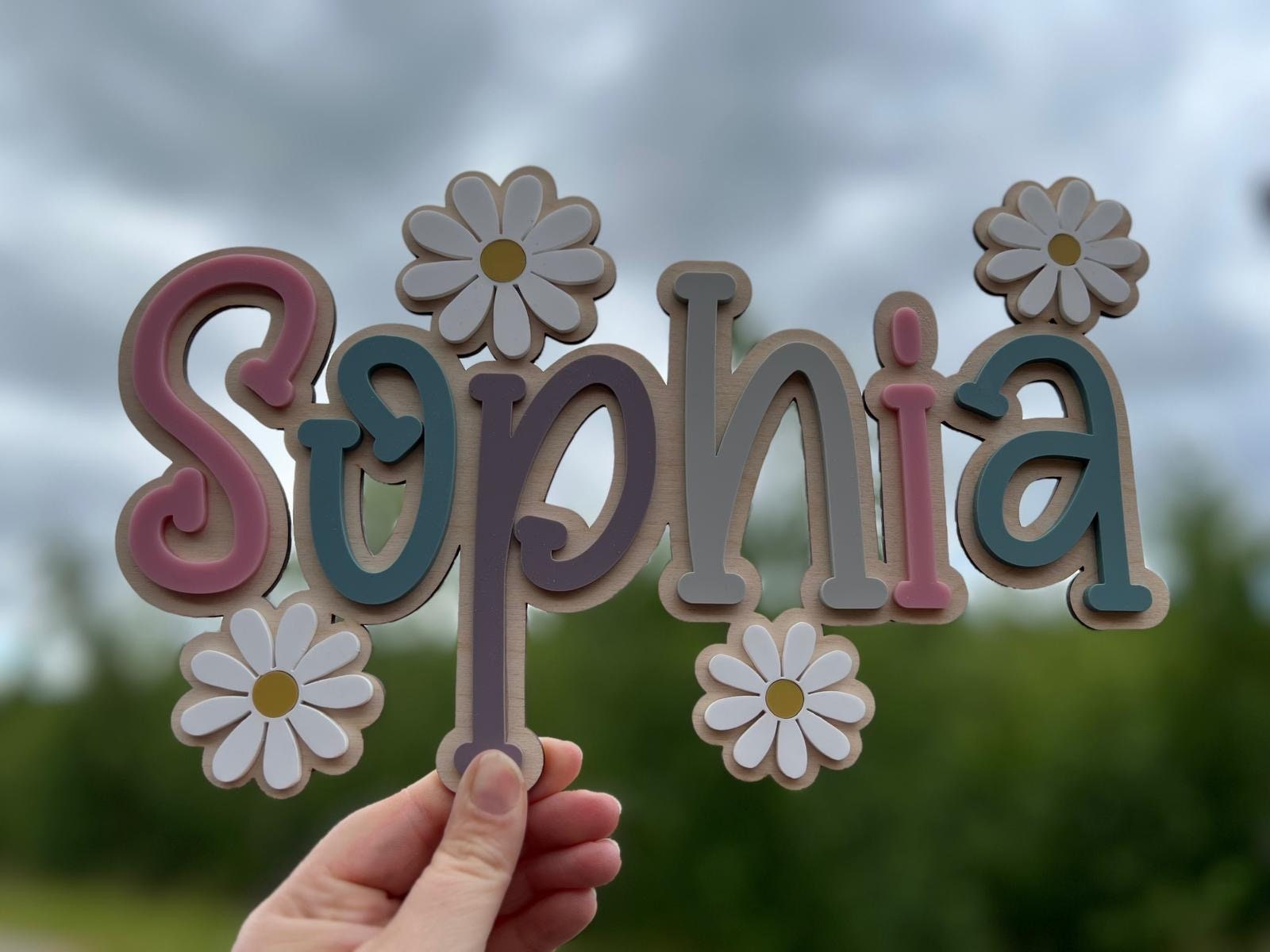 Wood name sign with flowers