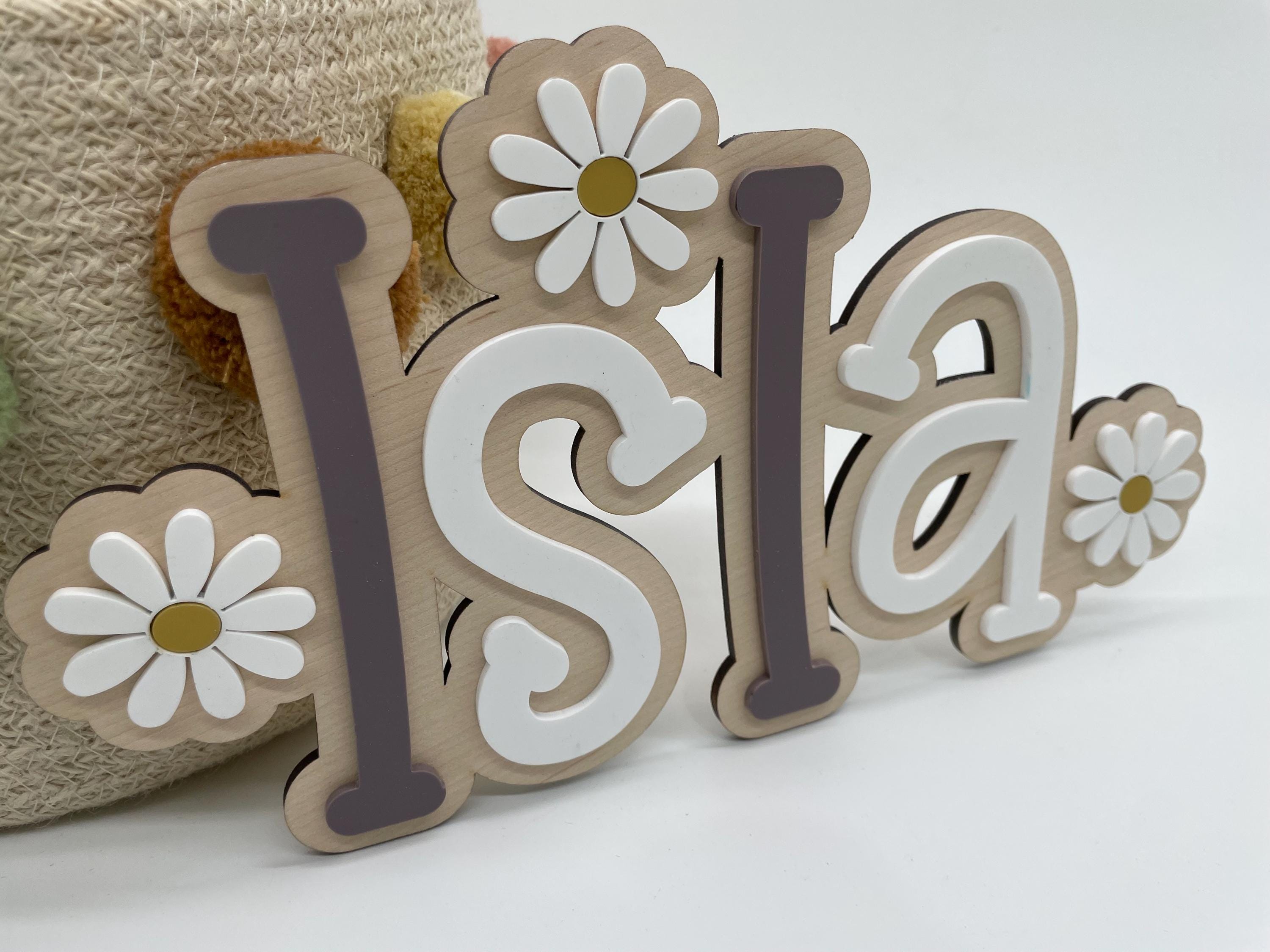 Wood name sign with flowers