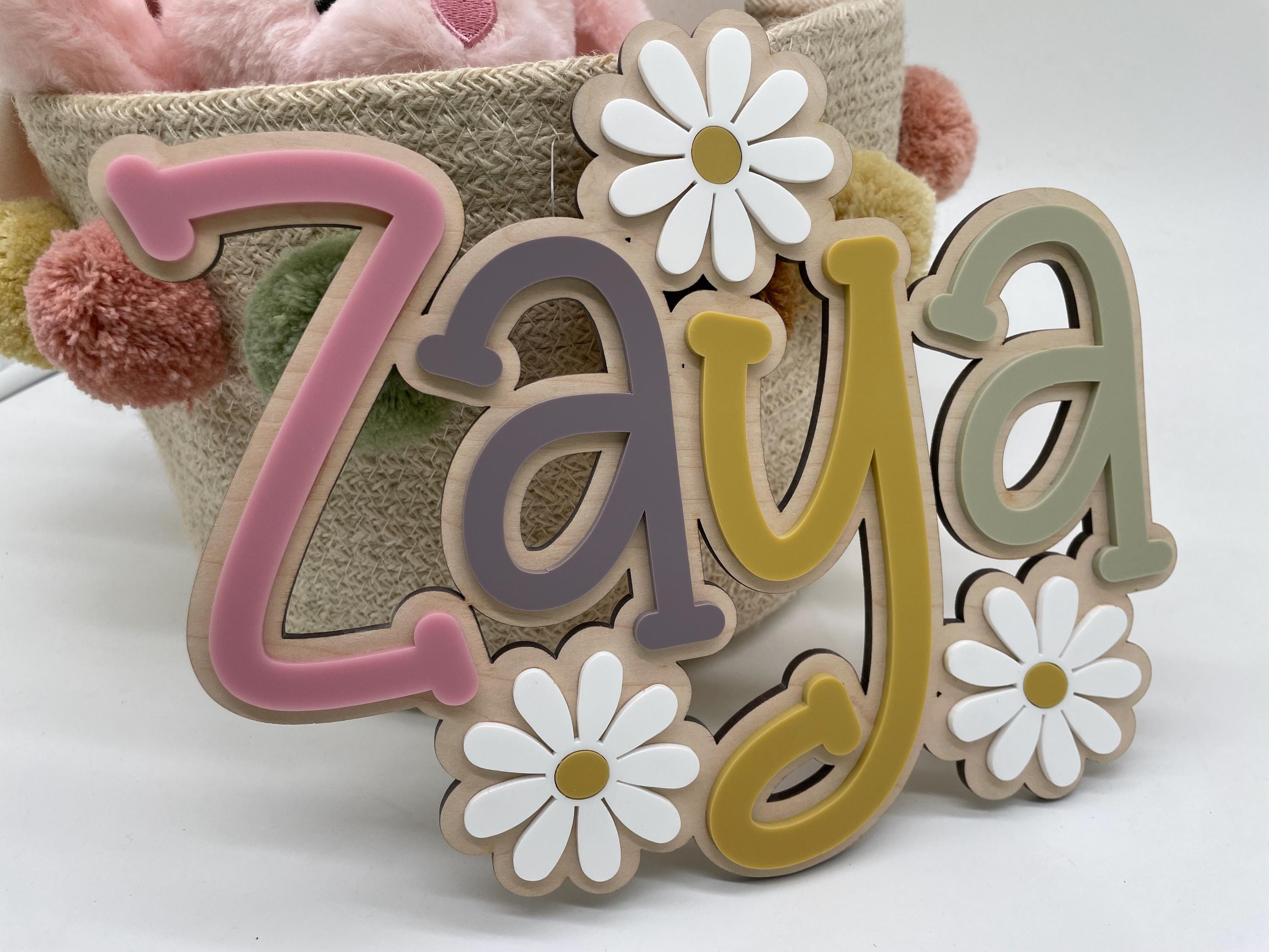 Wood name sign with flowers