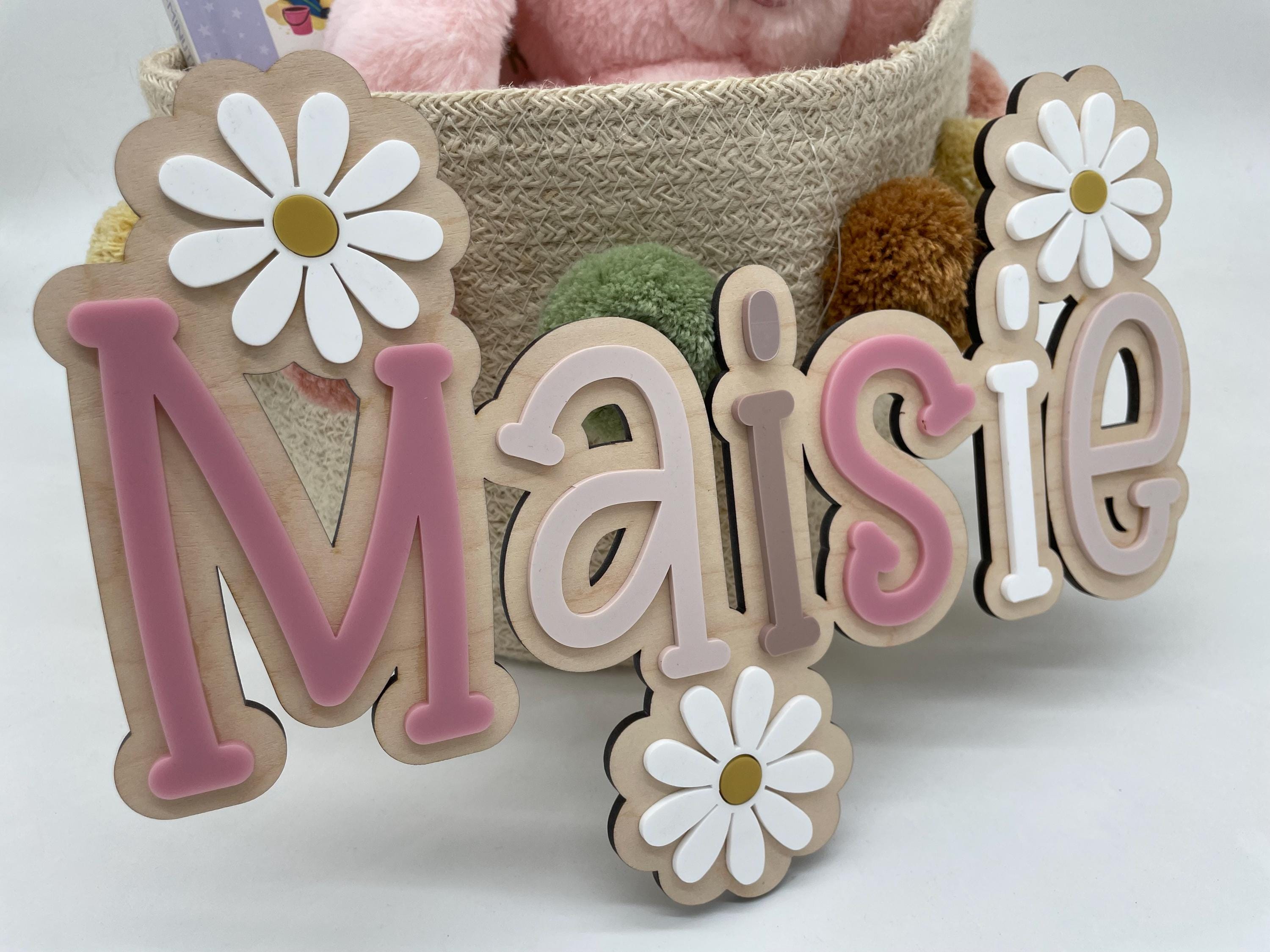 Wood name sign with flowers
